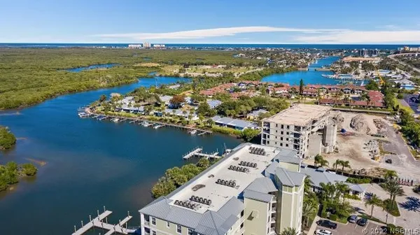 an aerial view of a house with a lake view