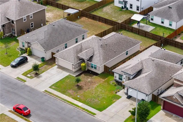 an aerial view of a house with a swimming pool