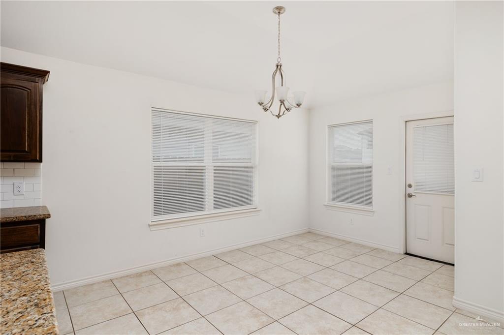 2302 North 26th Street Hidalgo, TX 78557 - Photo 5 of 19 a view of an empty room with a window