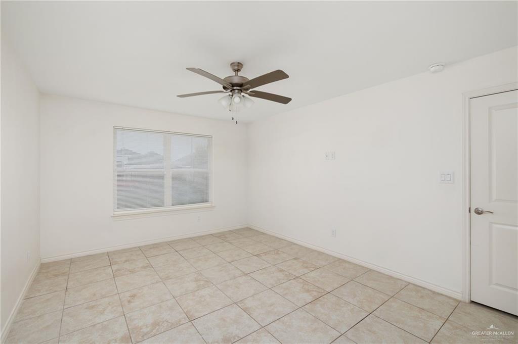 2302 North 26th Street Hidalgo, TX 78557 - Photo 6 of 19 an empty room with a empty space and windows