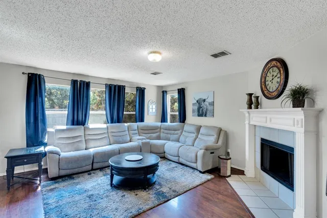 a living room with furniture and a fireplace