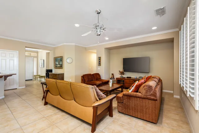a kitchen that has a sink cabinets counter space stainless steel appliances and a window