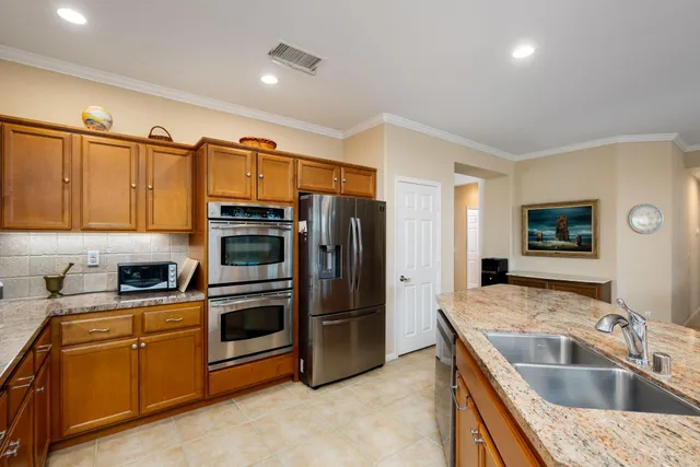 a bedroom with furniture and a large window