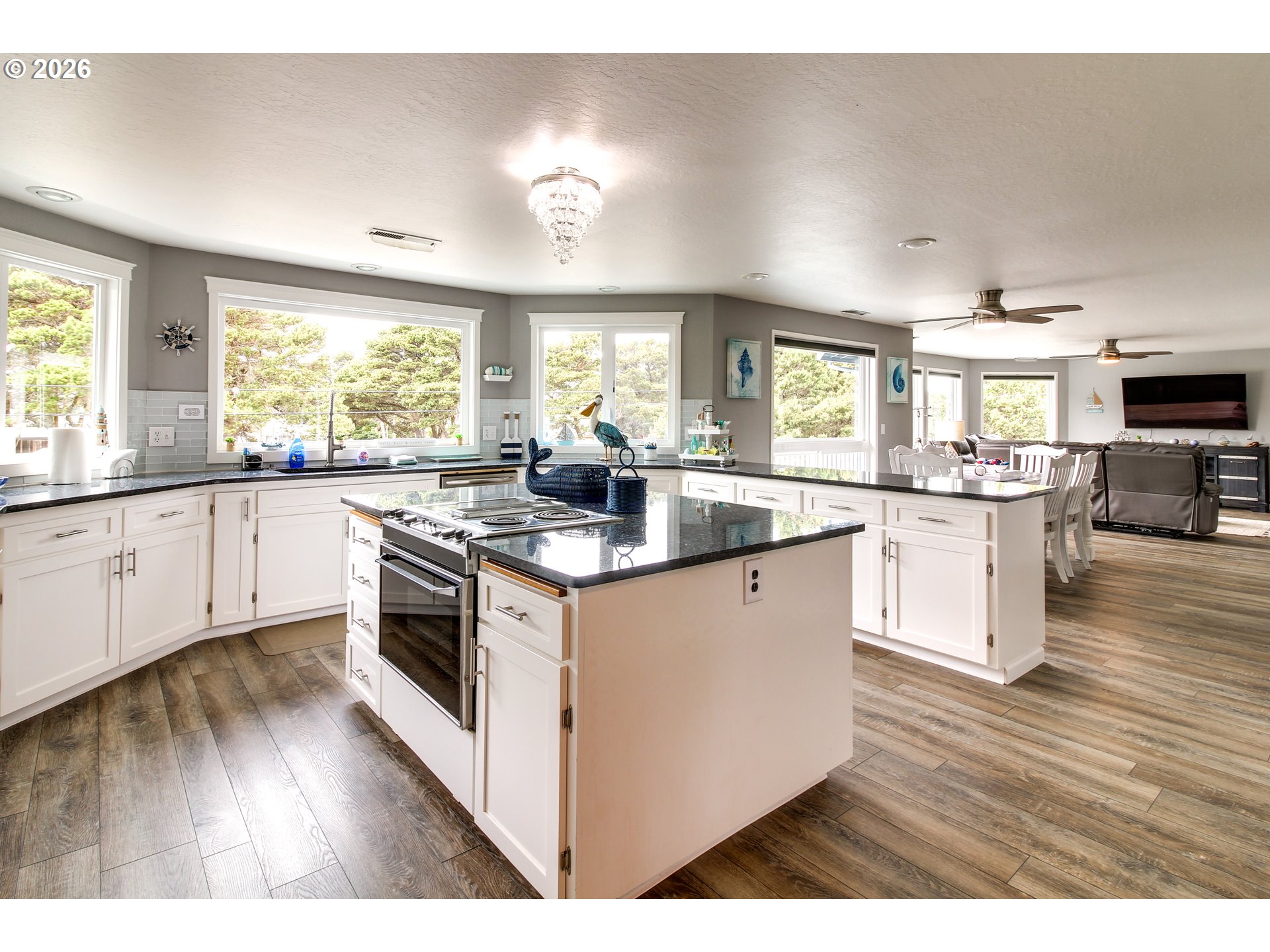 3085 Beach Loop Drive Southwest Bandon, OR 97411 - Photo 13 of 46 a kitchen with stainless steel appliances granite countertop a stove and cabinets