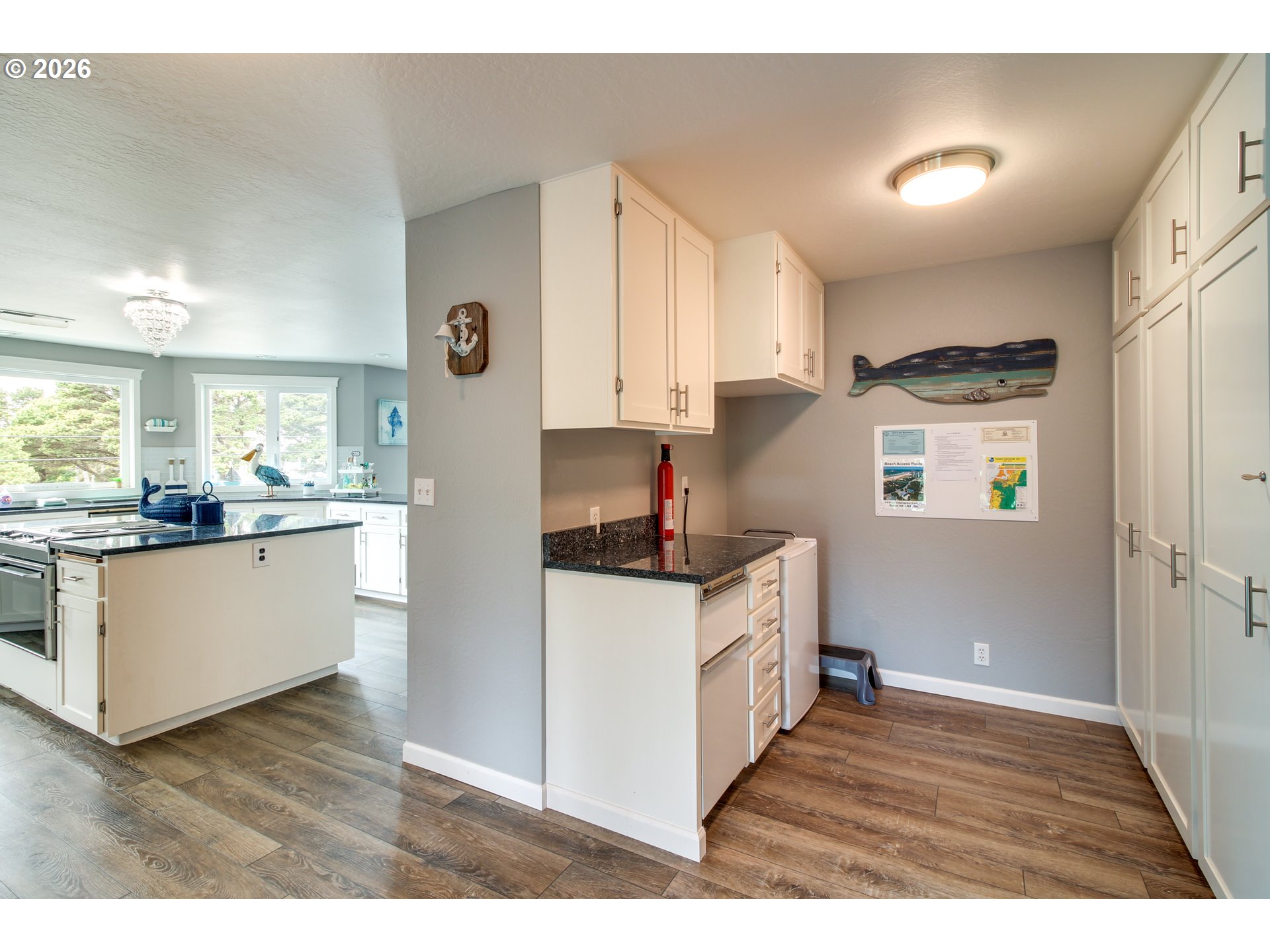3085 Beach Loop Drive Southwest Bandon, OR 97411 - Photo 15 of 46 a kitchen with stainless steel appliances granite countertop a refrigerator and a stove top oven