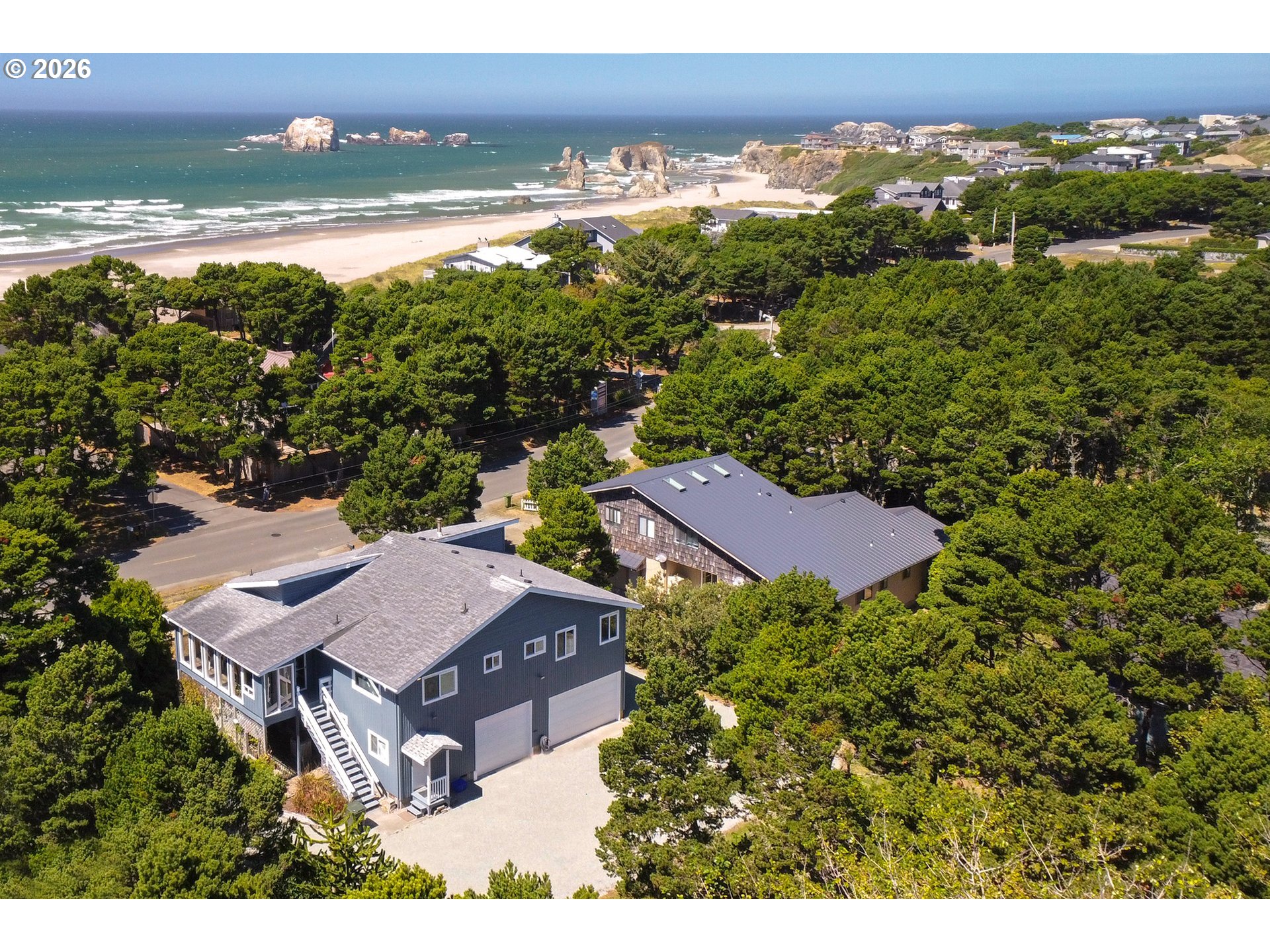 3085 Beach Loop Drive Southwest Bandon, OR 97411 - Photo 2 of 46 an aerial view of residential houses with outdoor space and ocean view