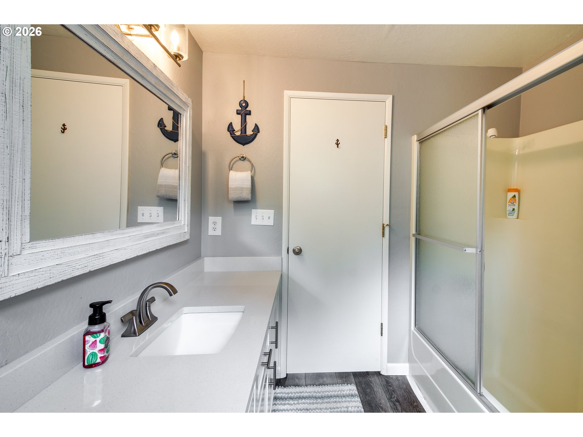 3085 Beach Loop Drive Southwest Bandon, OR 97411 - Photo 25 of 46 a bathroom with a sink and a mirror