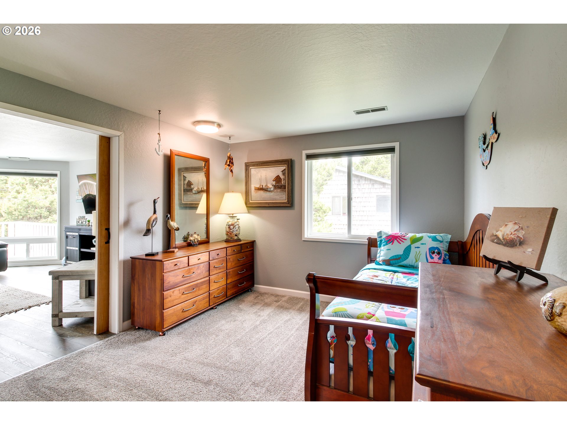 3085 Beach Loop Drive Southwest Bandon, OR 97411 - Photo 28 of 46 a living room with furniture and a wooden floor