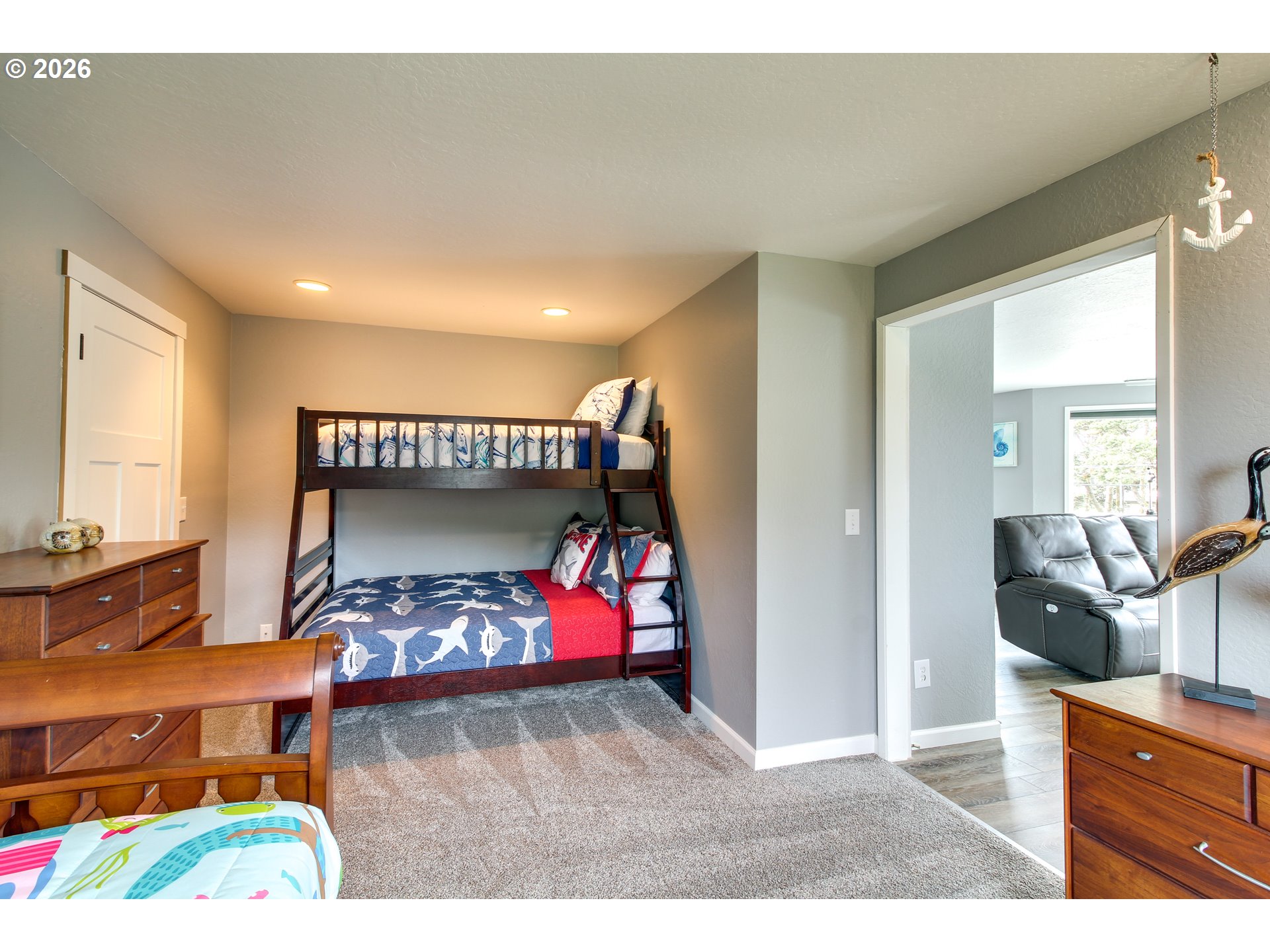 3085 Beach Loop Drive Southwest Bandon, OR 97411 - Photo 29 of 46 a bedroom with a bed and furniture