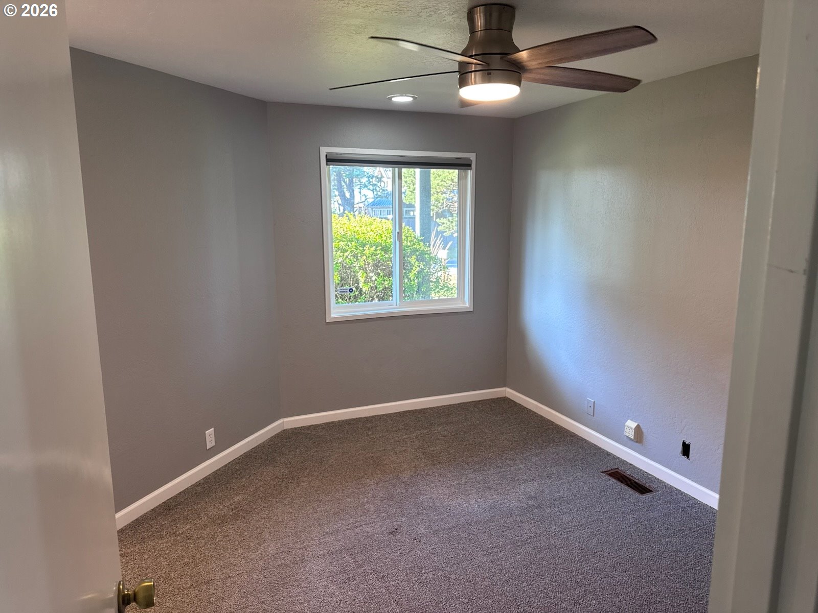 3085 Beach Loop Drive Southwest Bandon, OR 97411 - Photo 35 of 46 an empty room with windows and fan