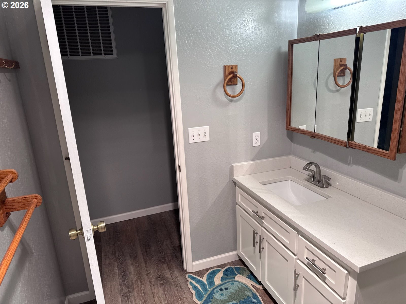 3085 Beach Loop Drive Southwest Bandon, OR 97411 - Photo 38 of 46 a bathroom with a sink and a mirror