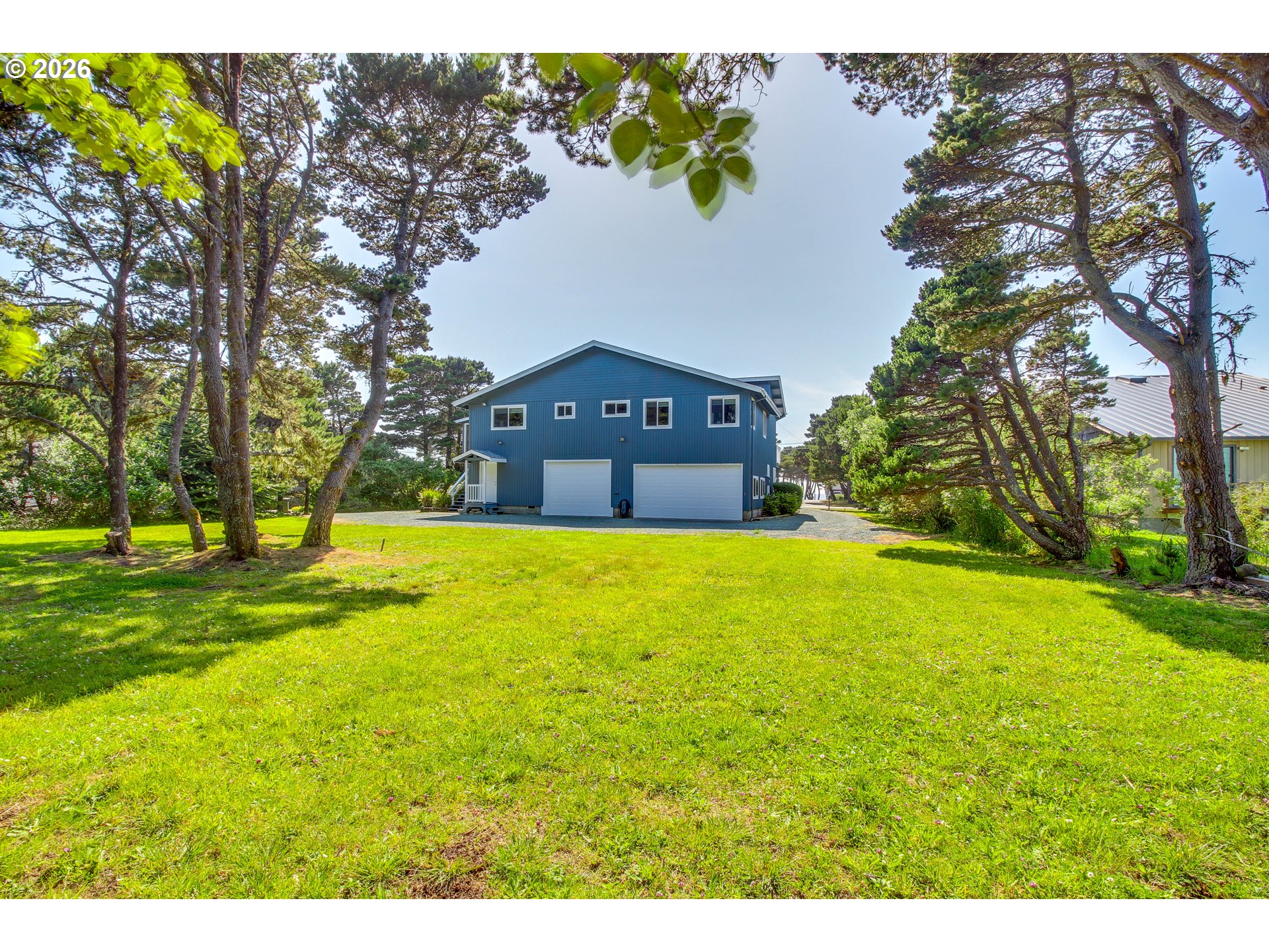 3085 Beach Loop Drive Southwest Bandon, OR 97411 - Photo 44 of 46 a house view with swimming pool in front of the house