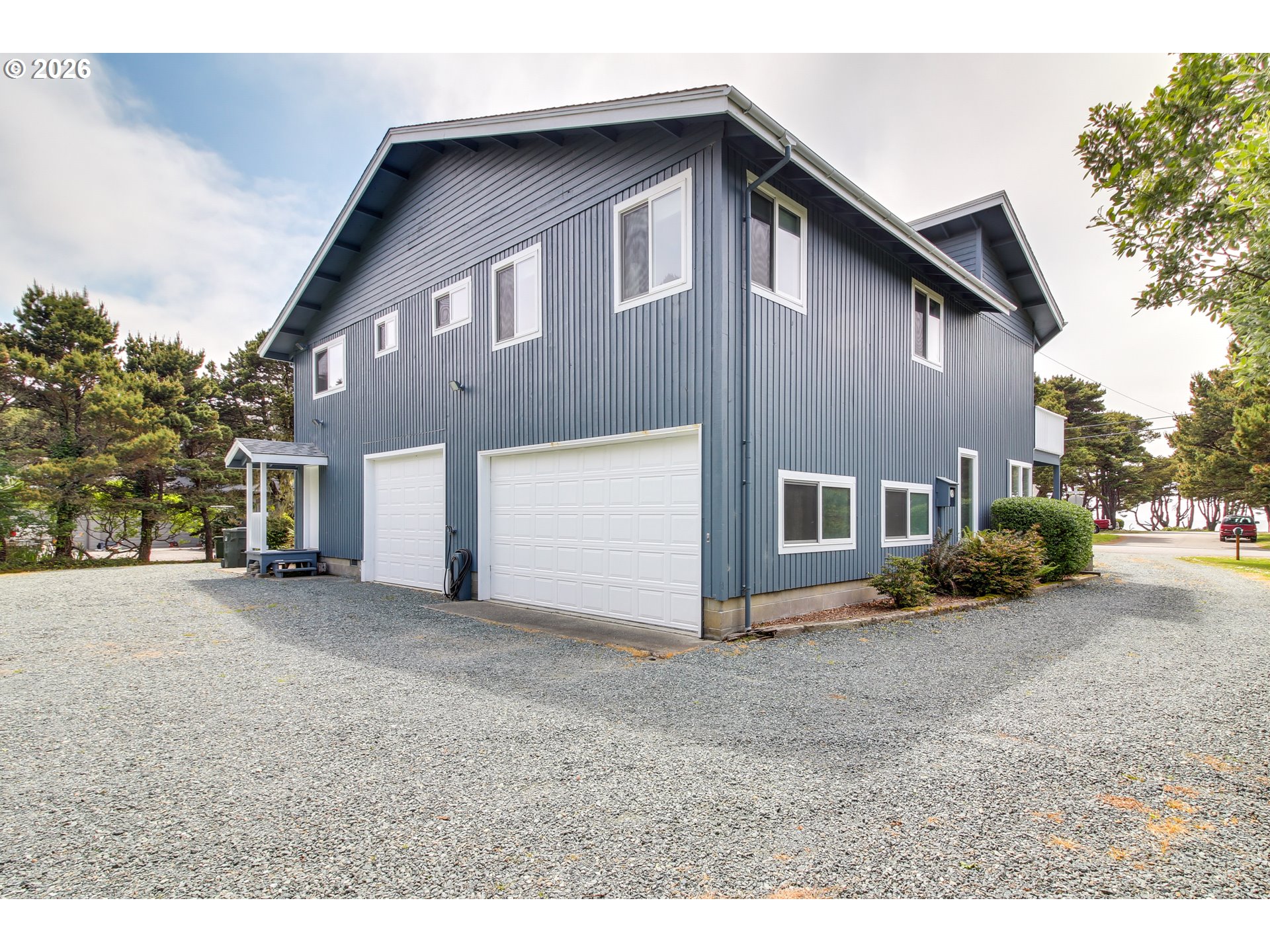 3085 Beach Loop Drive Southwest Bandon, OR 97411 - Photo 46 of 46 a front view of a house with a yard