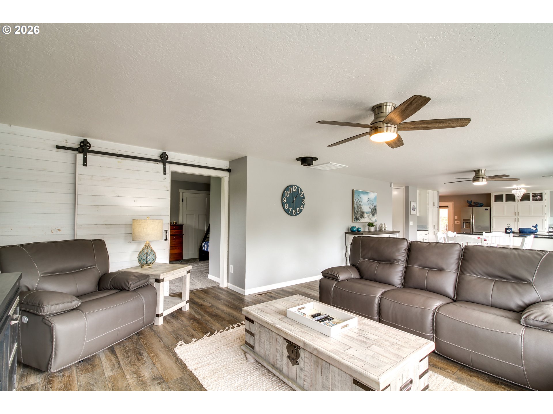 3085 Beach Loop Drive Southwest Bandon, OR 97411 - Photo 6 of 46 a living room with furniture and a ceiling fan