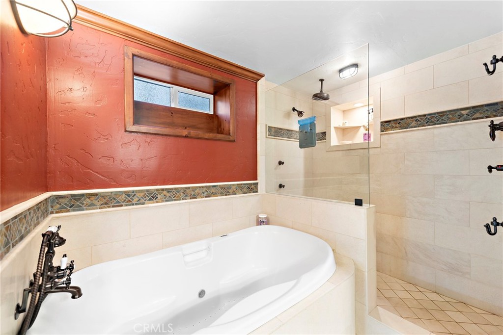 400 Cottage Grove Road Lake Arrowhead, CA 92352 - Photo 39 of 75 a bathroom with a tub and shower