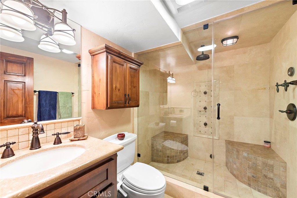 400 Cottage Grove Road Lake Arrowhead, CA 92352 - Photo 41 of 75 a bathroom with a sink a toilet and shower