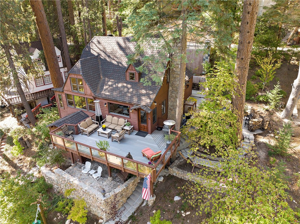 400 Cottage Grove Road Lake Arrowhead, CA 92352 - Photo 50 of 75 a view of a patio with table and chairs and potted plants