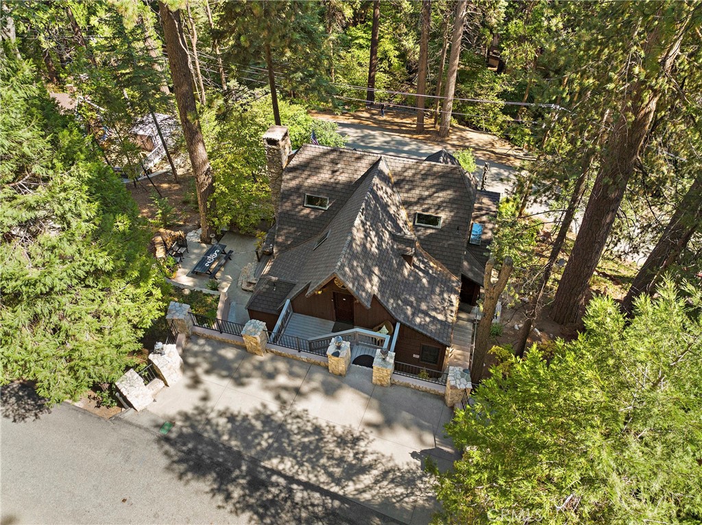 400 Cottage Grove Road Lake Arrowhead, CA 92352 - Photo 56 of 75 a backyard of a house with large trees and plants