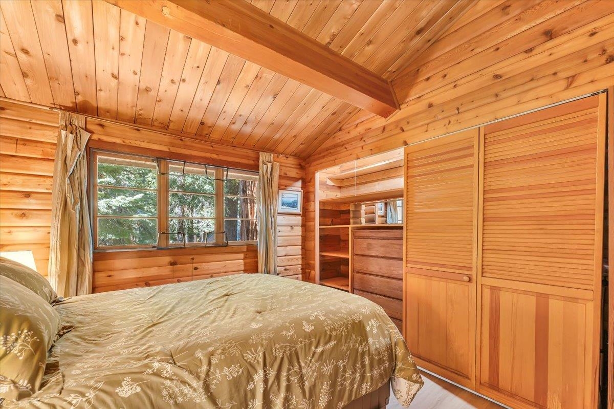 5520 Sacramento Avenue Homewood, CA 96141 - Photo 13 of 28 a bedroom with a bed and a large window