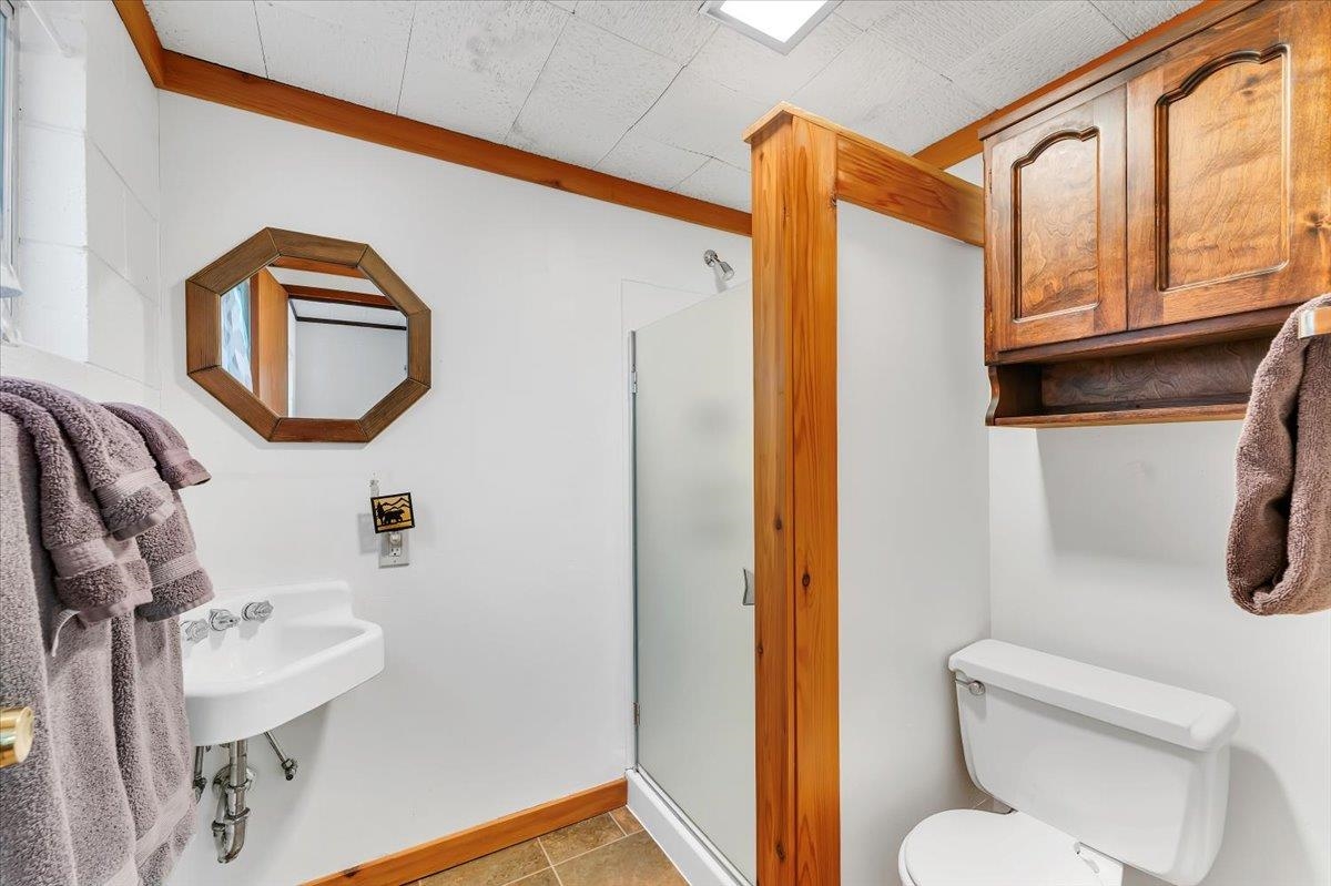 5520 Sacramento Avenue Homewood, CA 96141 - Photo 20 of 28 a bathroom with a toilet sink and mirror