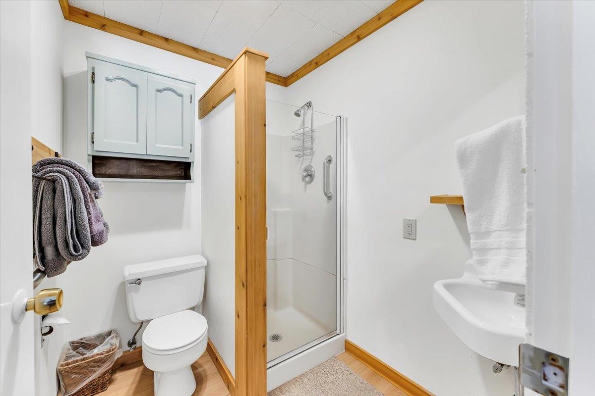 5520 Sacramento Avenue Homewood, CA 96141 - Photo 27 of 28 a bathroom with a toilet a sink and a shower