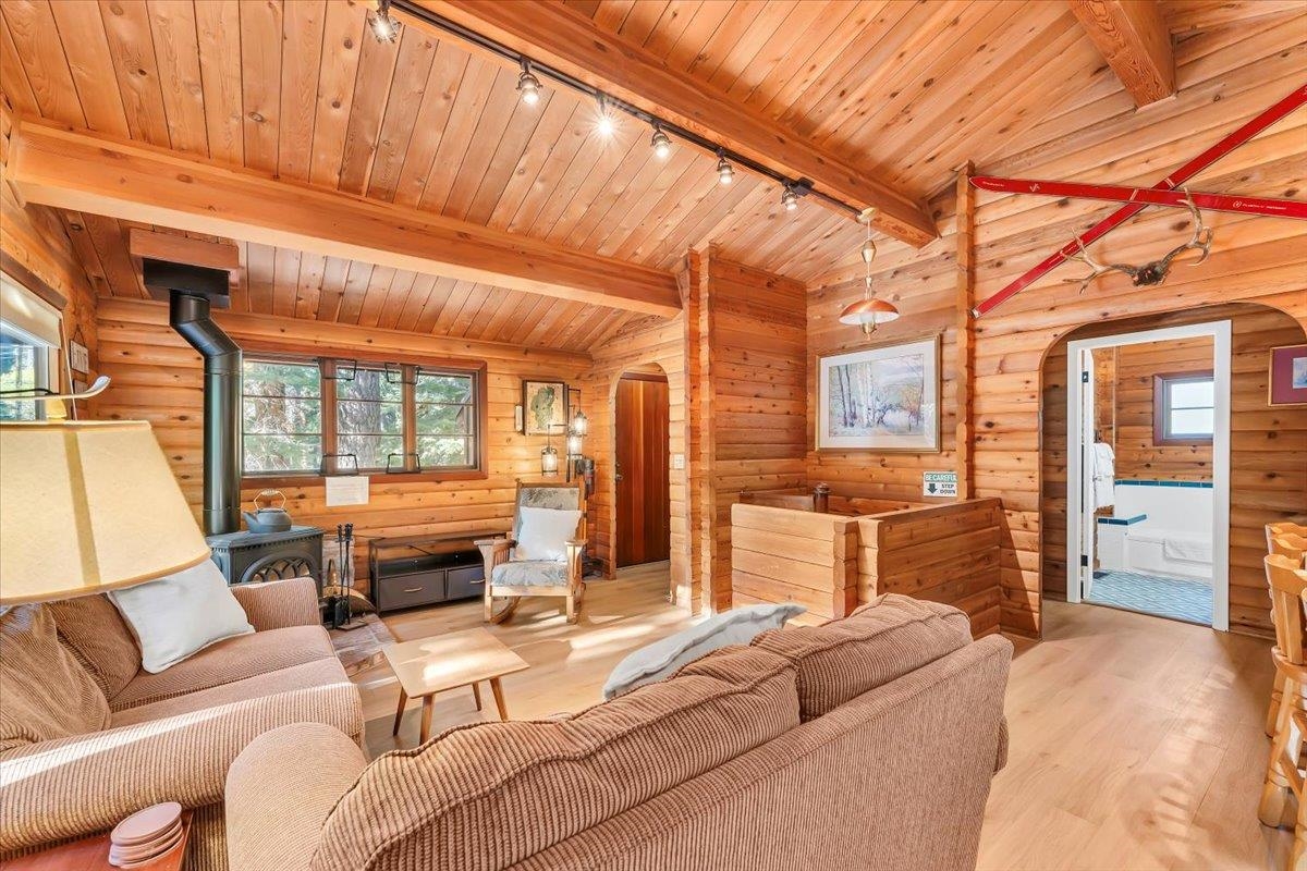 5520 Sacramento Avenue Homewood, CA 96141 - Photo 4 of 28 a bedroom with furniture and large windows