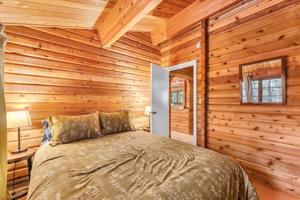 5520 Sacramento Avenue Homewood, CA 96141 - Photo 10 of 28 a bedroom with a bed and a dresser