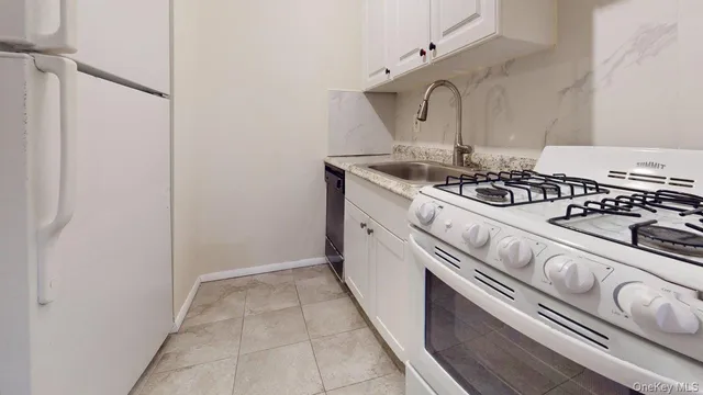 a kitchen with a stove and a sink