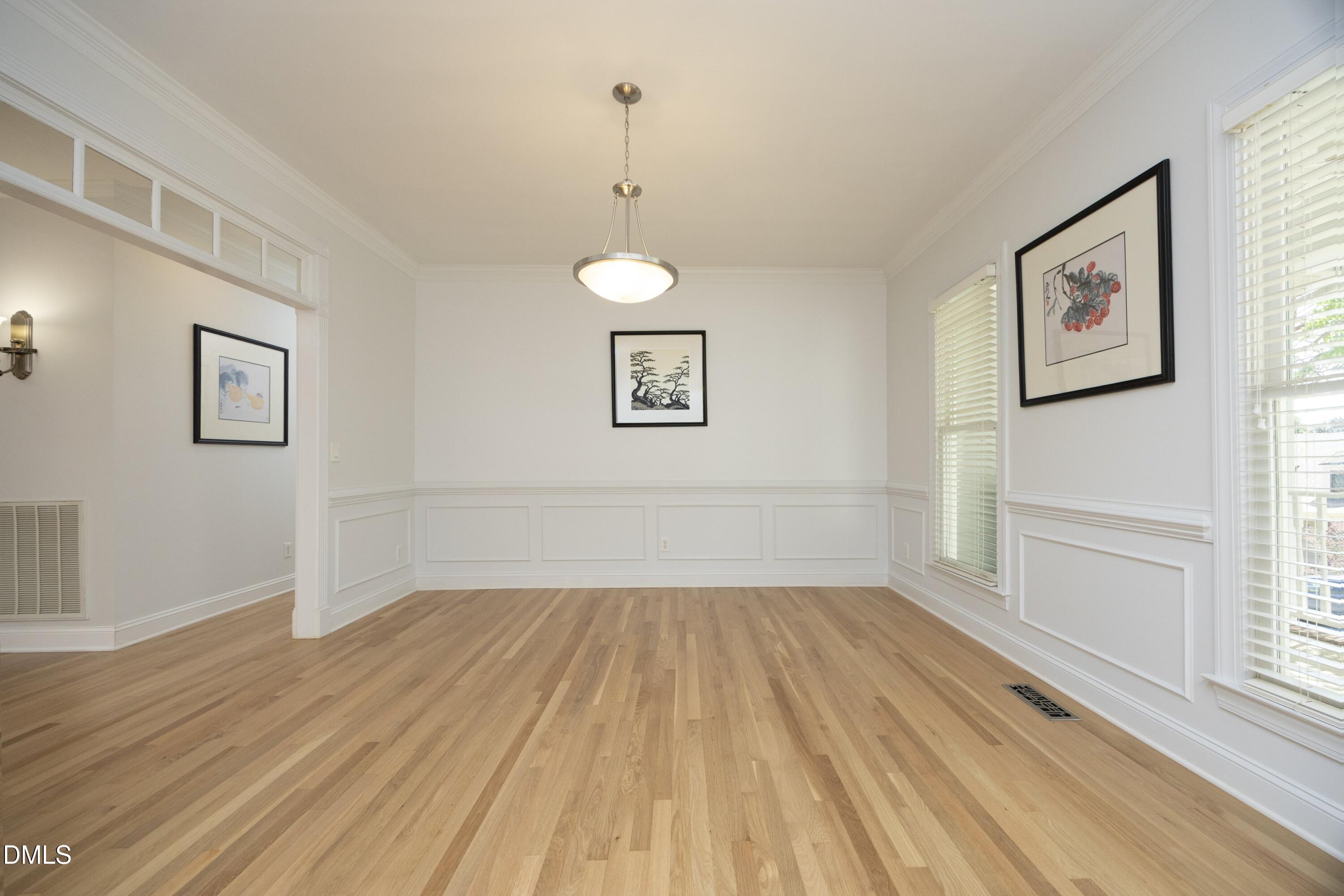 1427 Moosecreek Drive Raleigh, NC 27614 - Photo 12 of 48 a view of a room with wooden floor and window