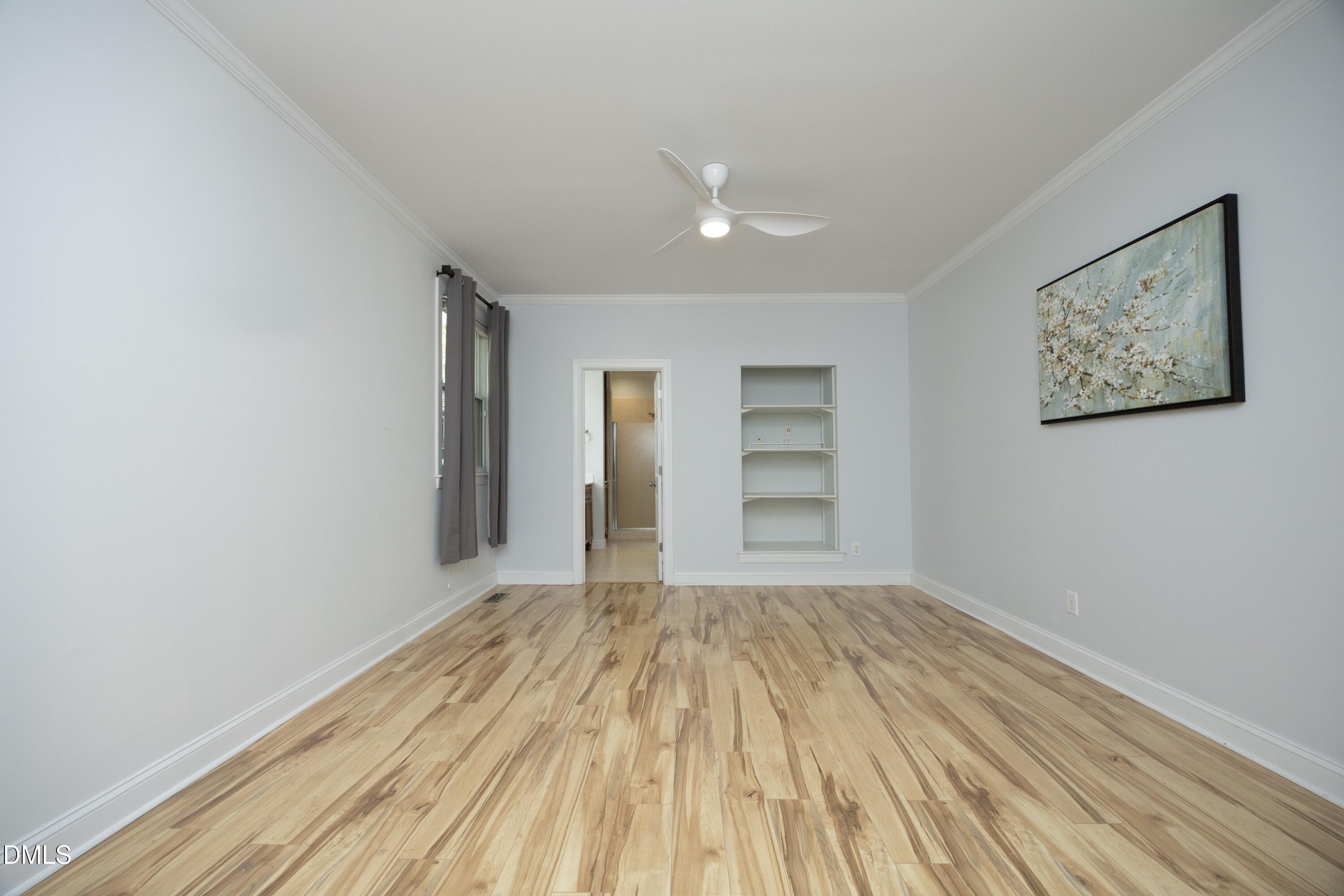 1427 Moosecreek Drive Raleigh, NC 27614 - Photo 22 of 48 a view of a room with wooden floor and window
