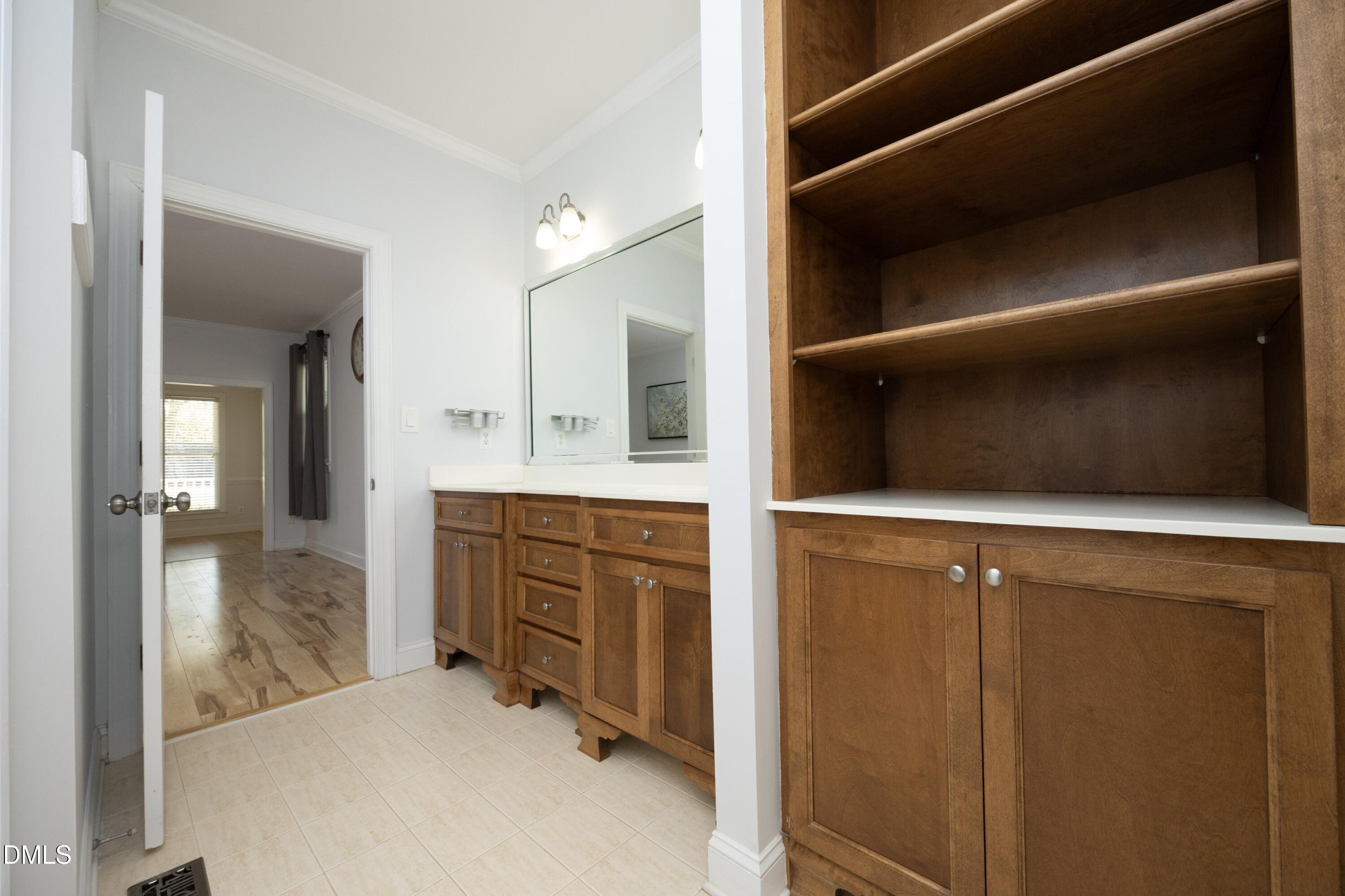 1427 Moosecreek Drive Raleigh, NC 27614 - Photo 24 of 48 a bathroom with a bathtub sink and mirror