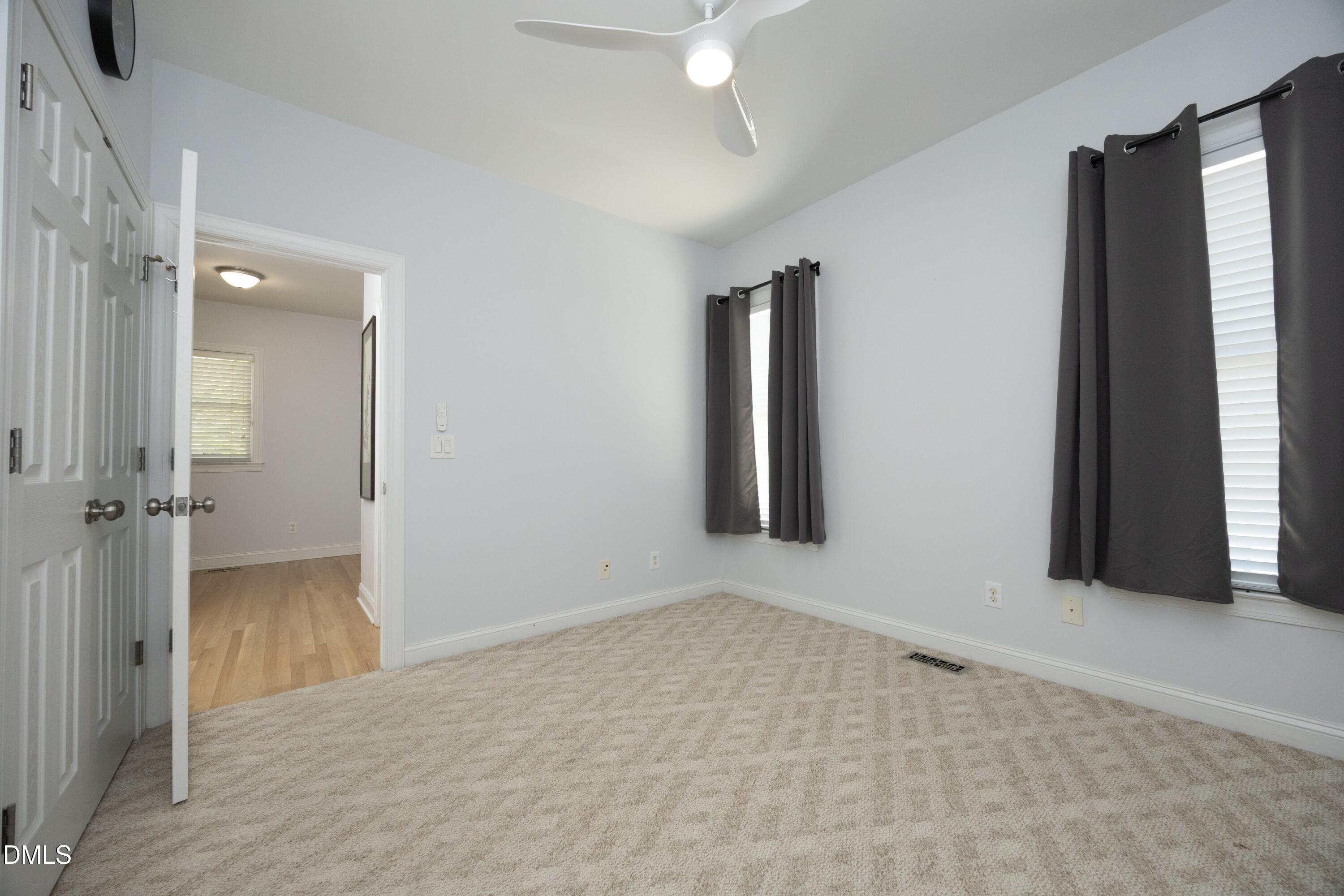 1427 Moosecreek Drive Raleigh, NC 27614 - Photo 25 of 48 an empty room with windows and closet