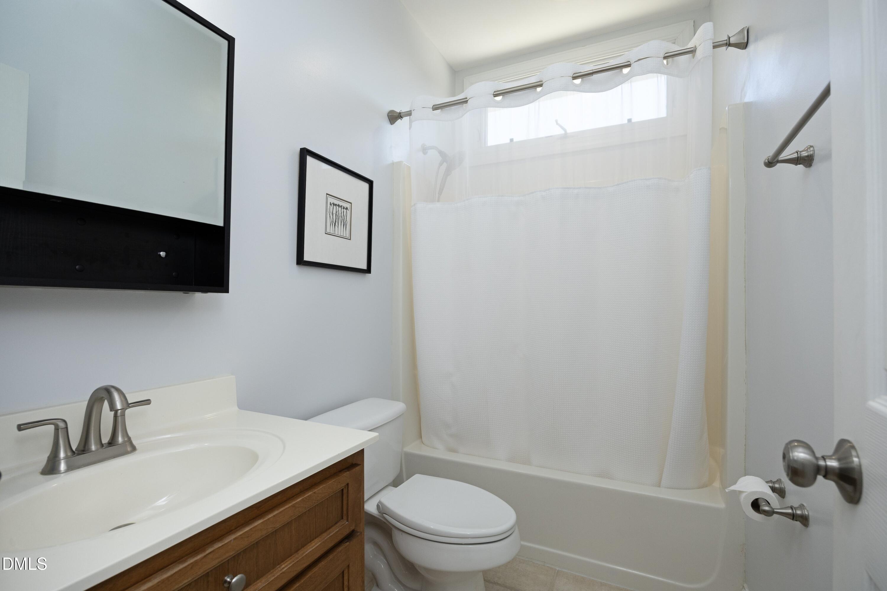 1427 Moosecreek Drive Raleigh, NC 27614 - Photo 26 of 48 a bathroom with a sink toilet and shower