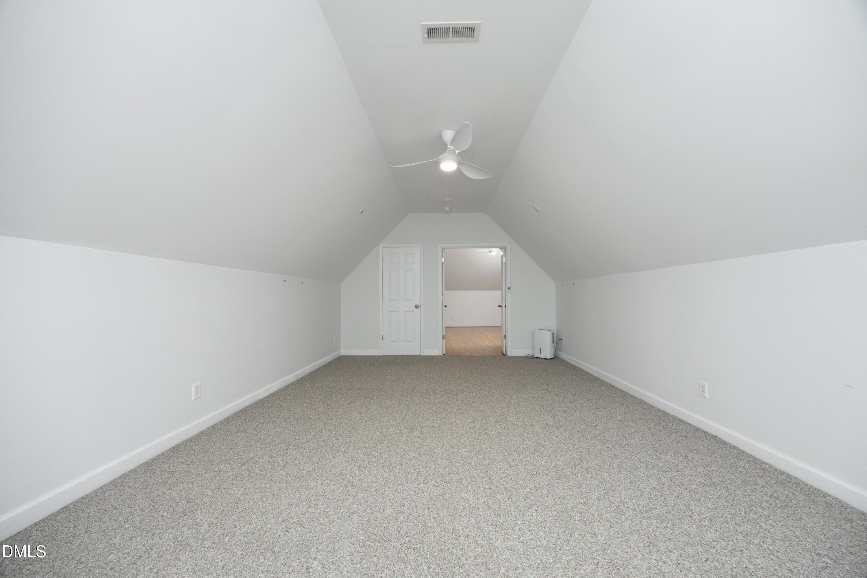 1427 Moosecreek Drive Raleigh, NC 27614 - Photo 33 of 48 an empty room with wooden floor and white walls