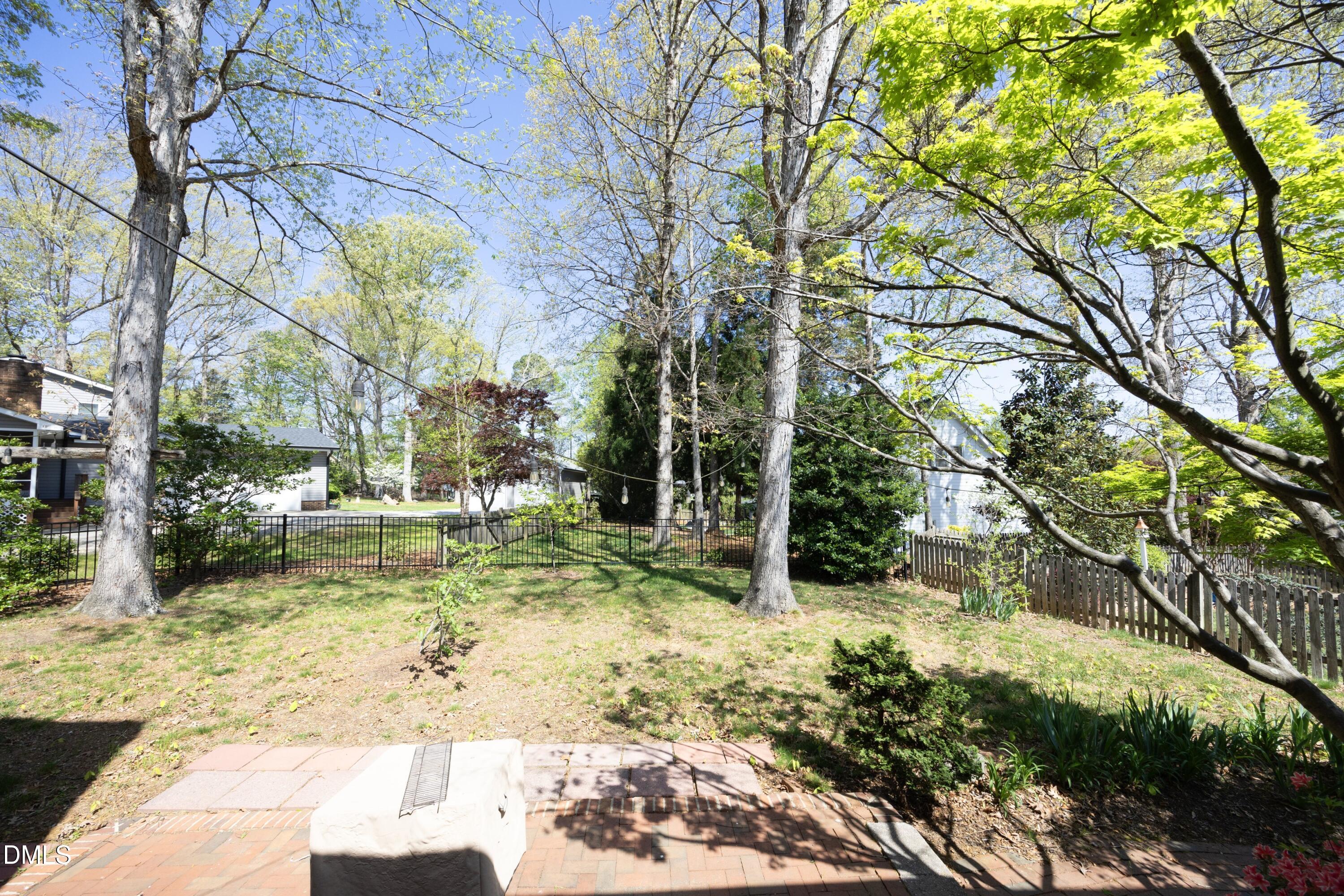 1427 Moosecreek Drive Raleigh, NC 27614 - Photo 40 of 48 a view of a yard with plants and large trees