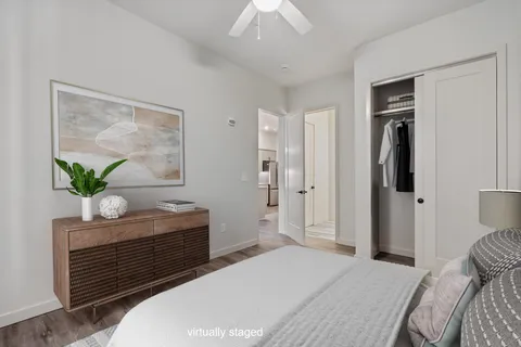 a bedroom with a bed and a dresser