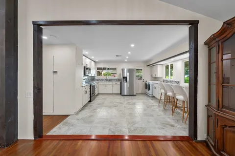 a utility room with sink dryer and washer