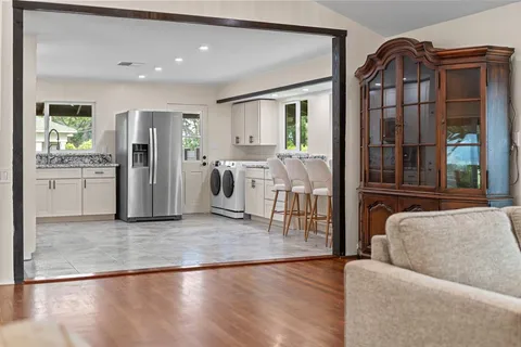 a bedroom with a large bed and a large window