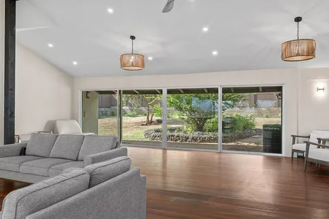 a room with furniture and a large window