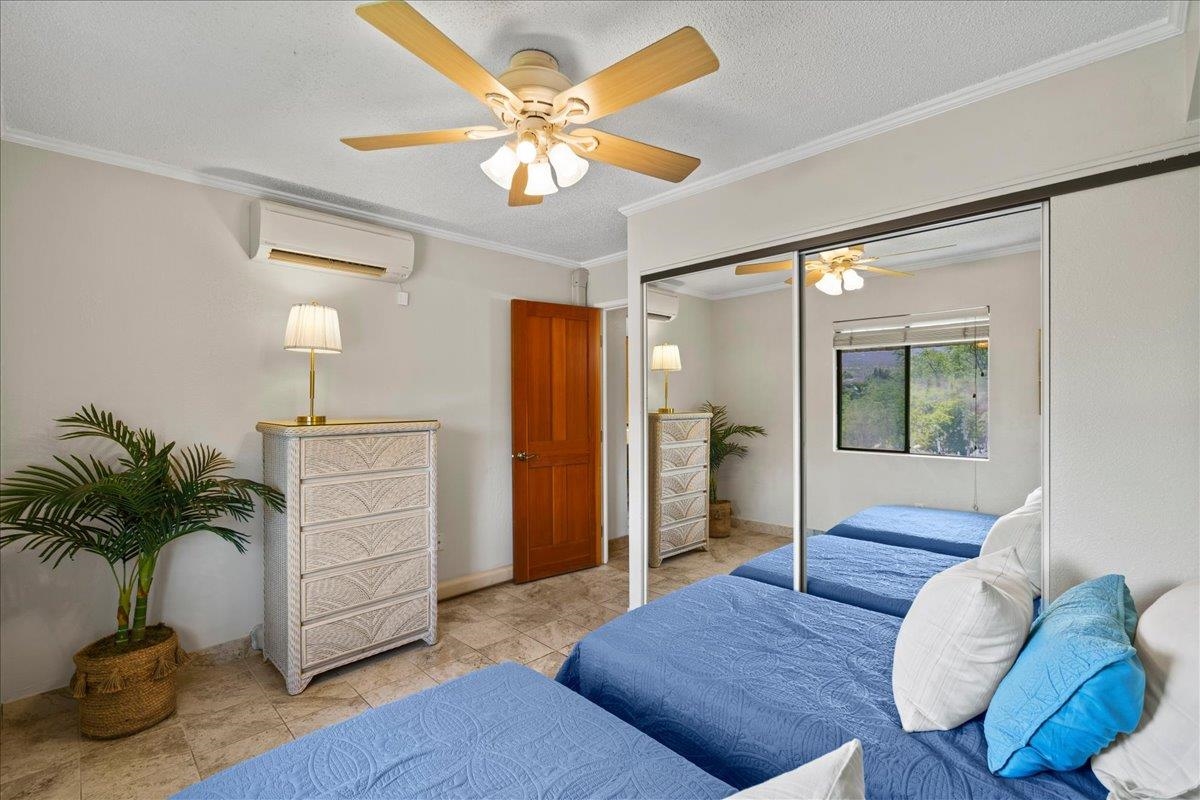 2219 South Kihei Road, Unit B414 Kihei, HI 96753 - Photo 28 of 42 a living room with furniture and a chandelier