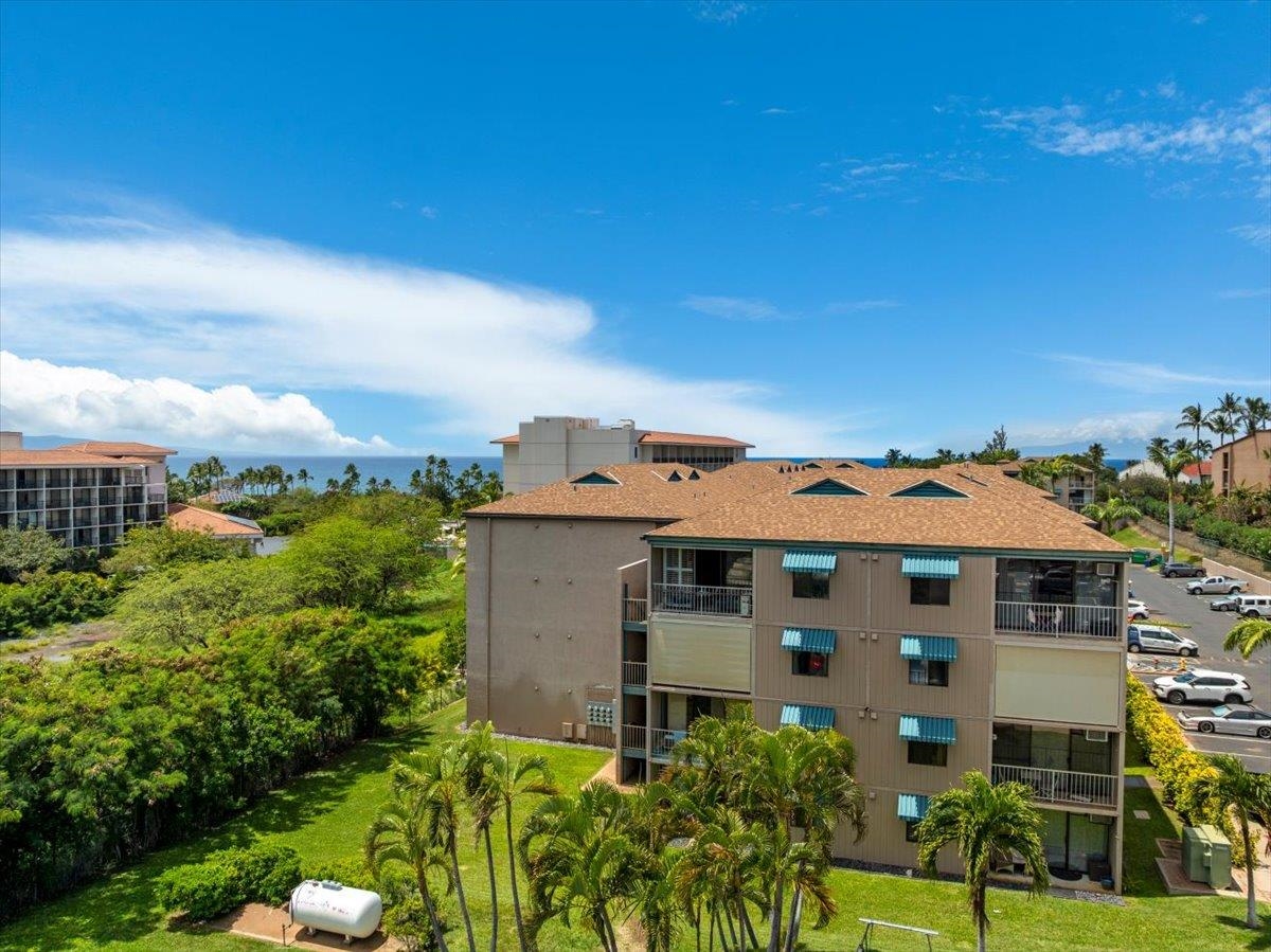 2219 South Kihei Road, Unit B414 Kihei, HI 96753 - Photo 39 of 42 front view of a house with a yard