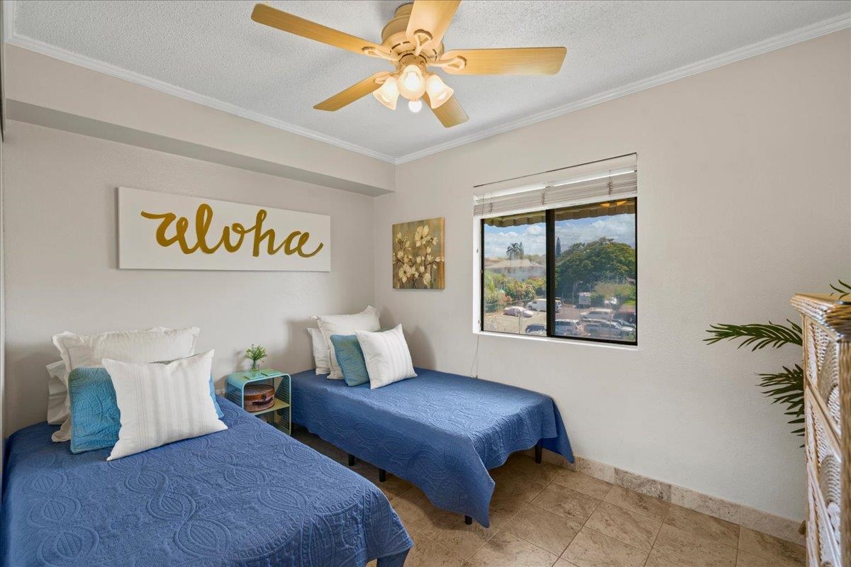 2219 South Kihei Road, Unit B414 Kihei, HI 96753 - Photo 5 of 42 a bedroom with bed and a window