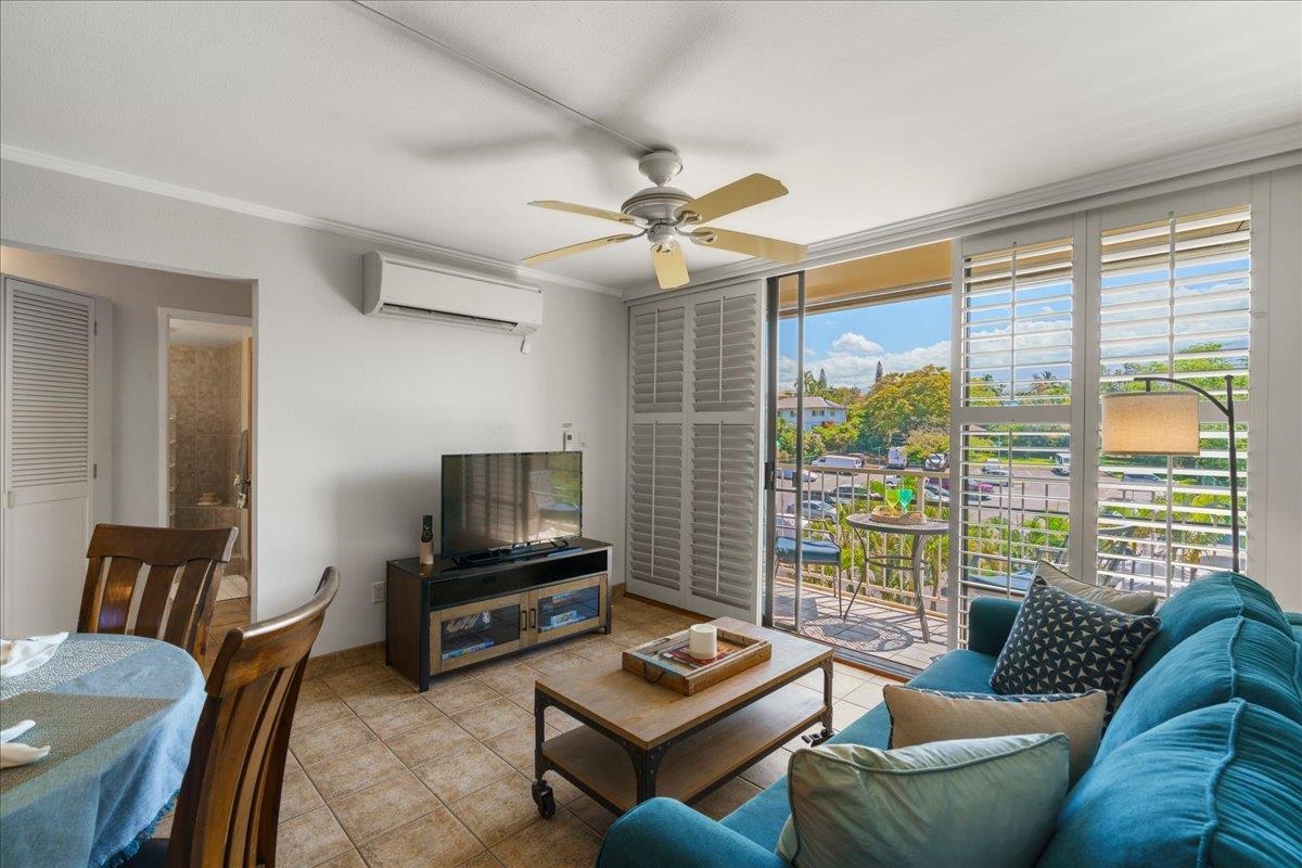 2219 South Kihei Road, Unit B414 Kihei, HI 96753 - Photo 10 of 42 a living room with furniture and a floor to ceiling window