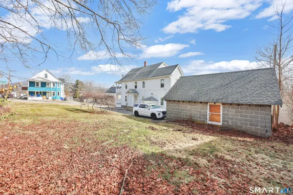 a view of a house with large space and a big yard
