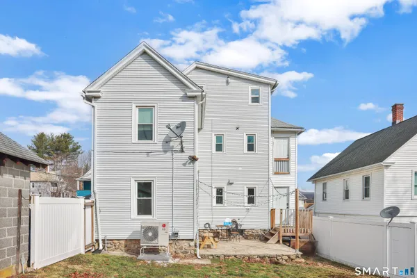 a bedroom with a bed and flat screen tv
