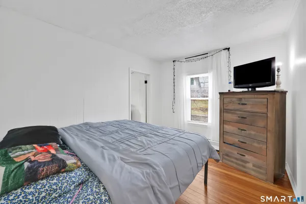 a bedroom with furniture and a bed