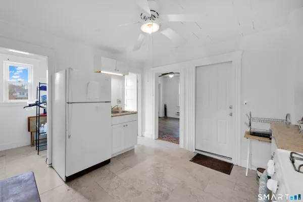 a kitchen with a sink cabinets and window