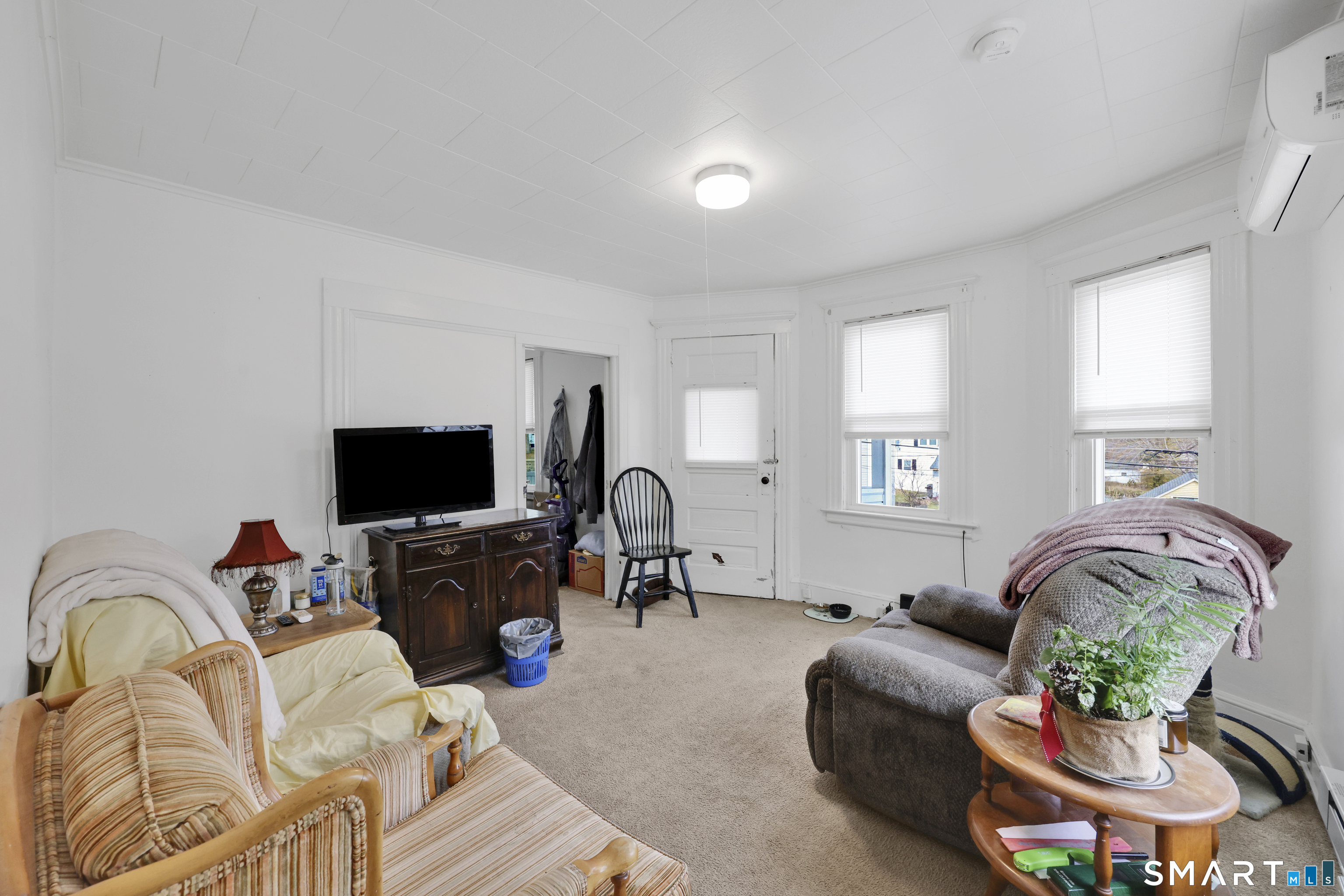 169 Central Avenue Torrington, CT 06790 - Photo 25 of 31 a living room with furniture a flat screen tv and a window