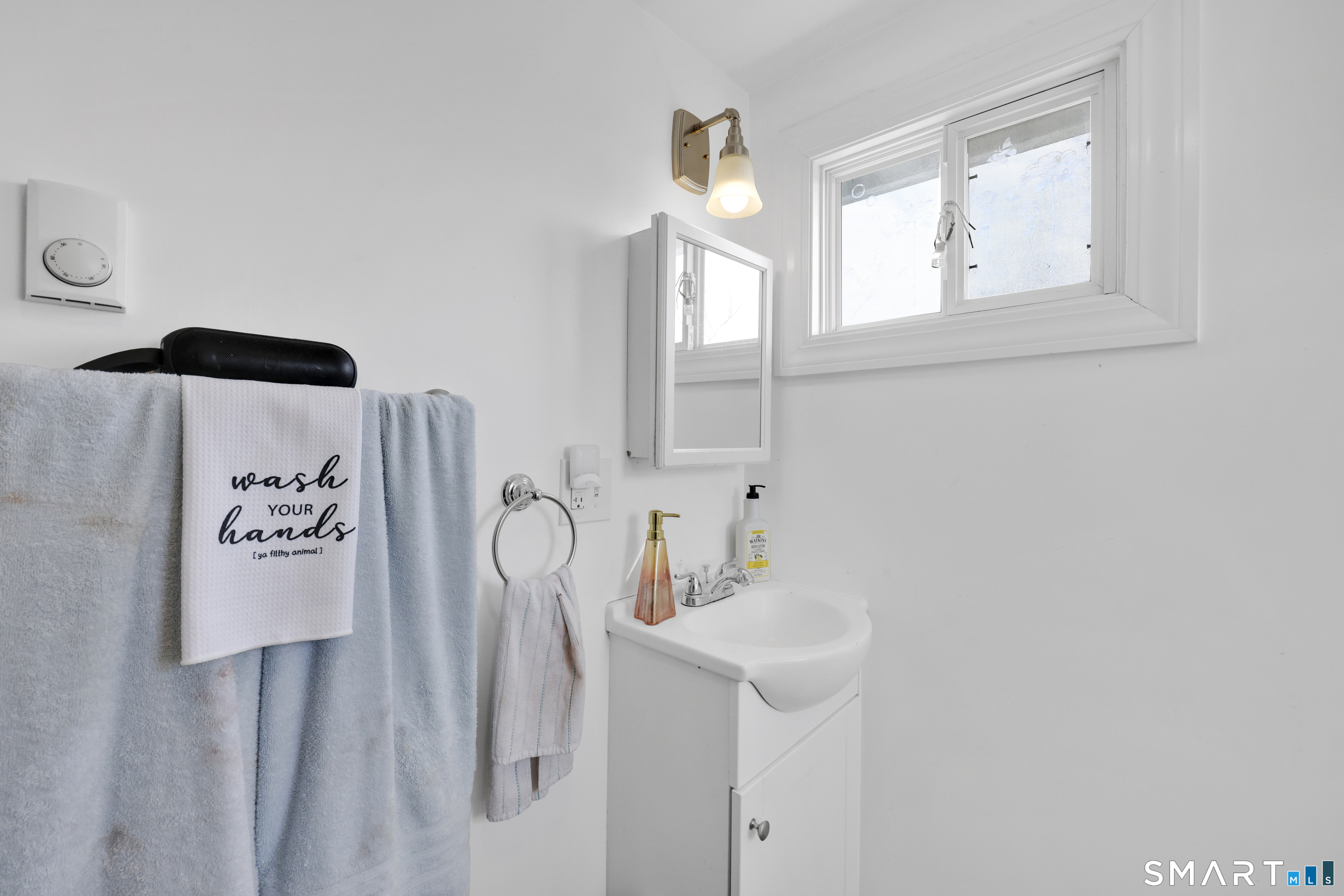169 Central Avenue Torrington, CT 06790 - Photo 30 of 31 a bathroom with a sink and a mirror