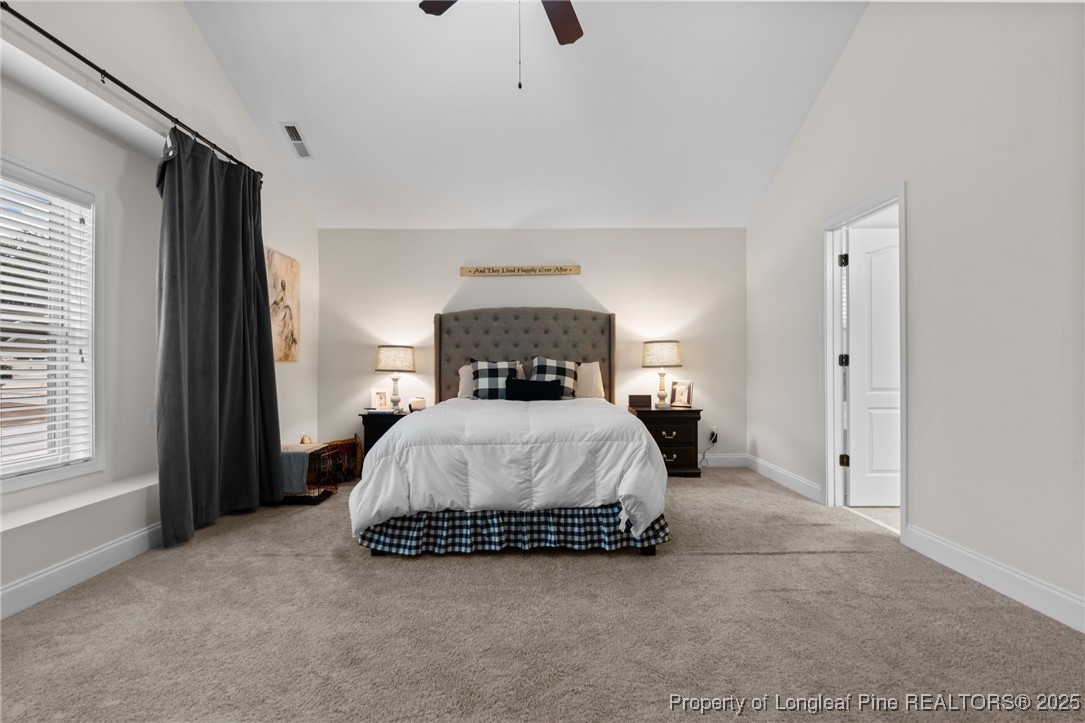 182 Valley Stream Road Spring Lake, NC 28390 - Photo 13 of 26 a bedroom with a bed and window